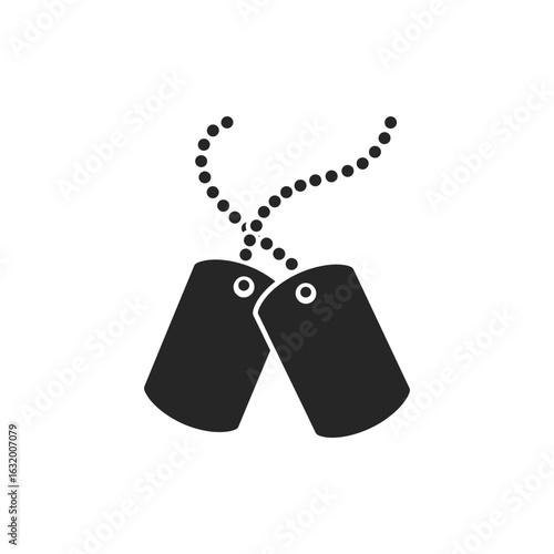 Two military dog tags hanging on a chain against a black background.