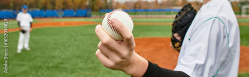 Canvas Print teenage boy enjoys a competitive baseball game on a field