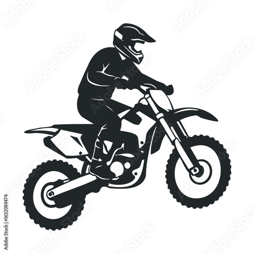 Silhouette of a male motorcyclist performing a dirt bike jump