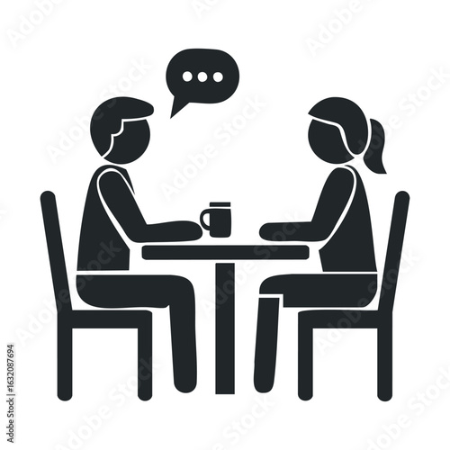 Silhouette of two adults conversing over coffee at a table