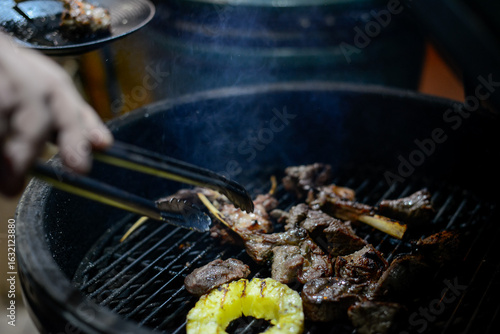 barbecue meat kare is being fried on a Mongolian grill