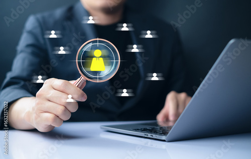 analyzing and selecting target candidate representing recruitment, HR technology, talent search Professional analyzing user data with a computer, surrounded by network icons. digital hiring strategies