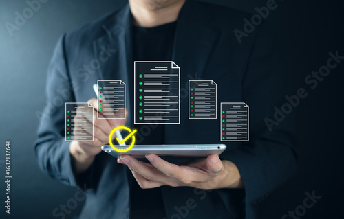 Checklist with ISO and document concept Digital documents and checklists above a laptop professional in a dark setting. products quality assurance, standard compliance international standards