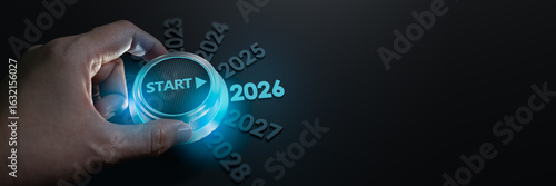 happy new year 2026,Finger about to twist the start button 2026 with the text 2025,2026,2027 and start on twist button.Concept of planning,start,career path,business strategy,opportunity and change
