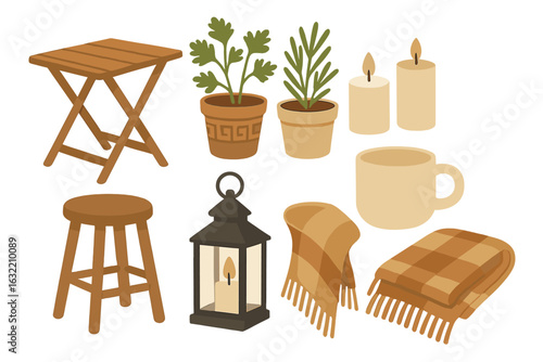 Cozy home decor items arranged on a white background showcasing warmth and comfort for interior styling