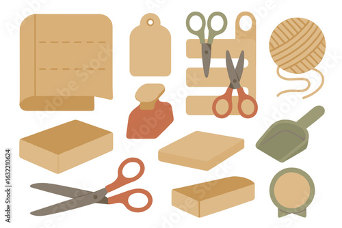 Assorted crafting supplies including scissors, tags, and cardboard boxes arranged on a flat surface