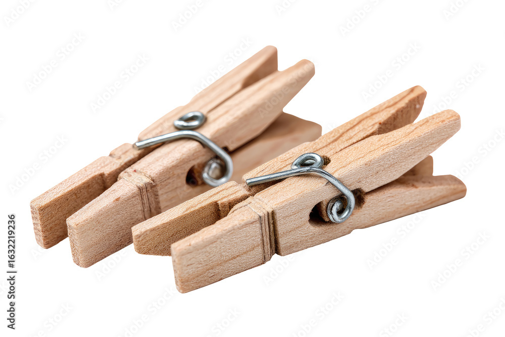 Two light brown wooden clothespins, close-up, angled slightly. Metal spring clips visible Two light brown wooden clothespins, close-up, angled slightly. Metal spring clips visible