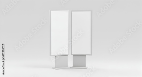 Angled View of Two Blank Vertical Advertising Kiosk Mockups