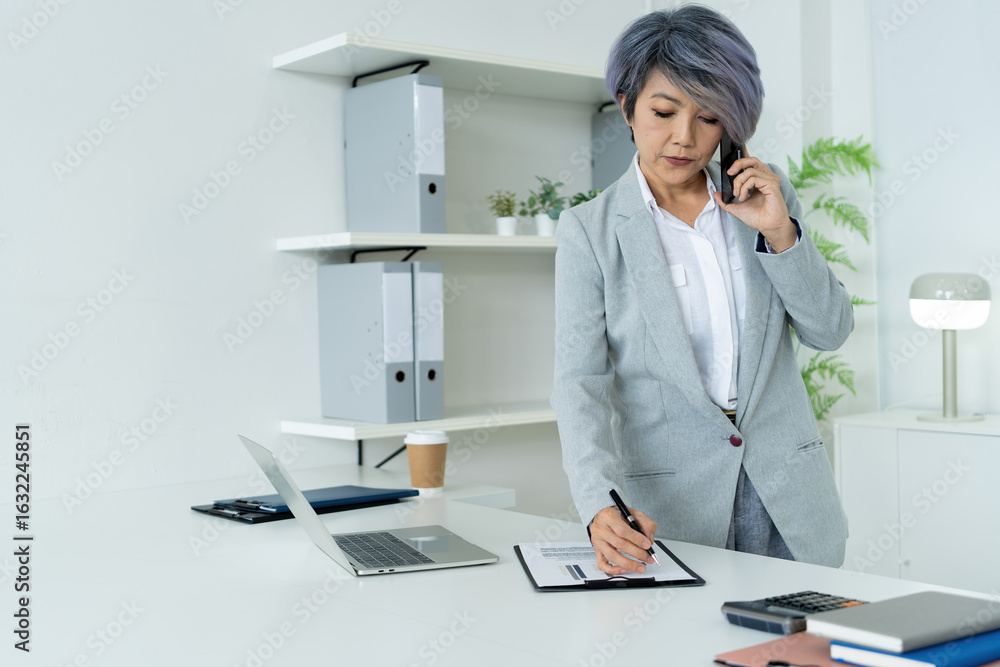 custom made wallpaper toronto digitalConfident Mature Businesswoman in Modern Office Using Technology with Positive Energy and Professional Presence.
