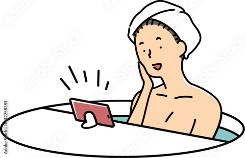 動画を視聴しながら半身浴をする女性