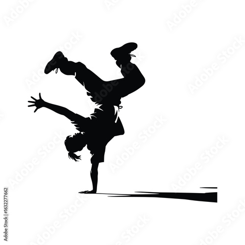 Silhouette of a breakdancer performing a dynamic handstand move