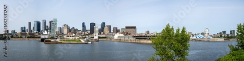 Panoramic view of Old Montreal along the St. Lawrence River in summer