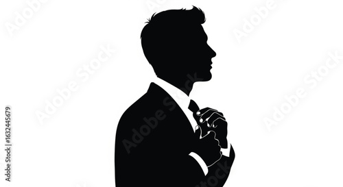 Businessman adjusting tie with confidence