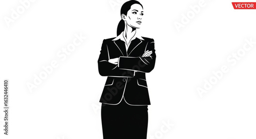 Confident businesswoman in suit standing with arms crossed