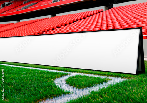 Blank Advertising Hoarding on Green Football Pitch in an Empty Stadium