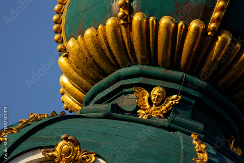 Photography Gilded cherub decoration on a baroque dome of St