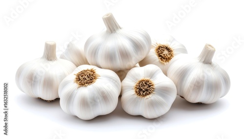 Fresh garlic bulbs arranged on a white surface, showcasing their natural texture and form