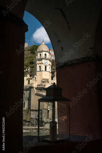 Through the arched window of a medieval passage - Church of Santa Margherita ...