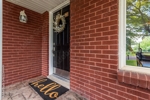 Entrance to a red bricked house.
