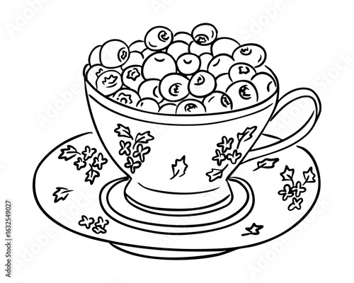 Vintage teacup filled with ripe blueberries on a matching floral saucer. Concept of healthy eating, natures sweetness and rustic kitchen charm
