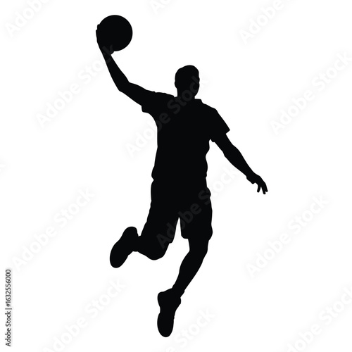 Silhouette of a basketball player in mid air dunking