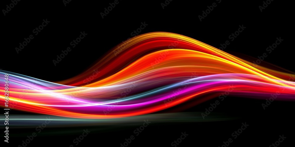 Naklejka premium Vibrant abstract light trails in bold colors on a dark background.