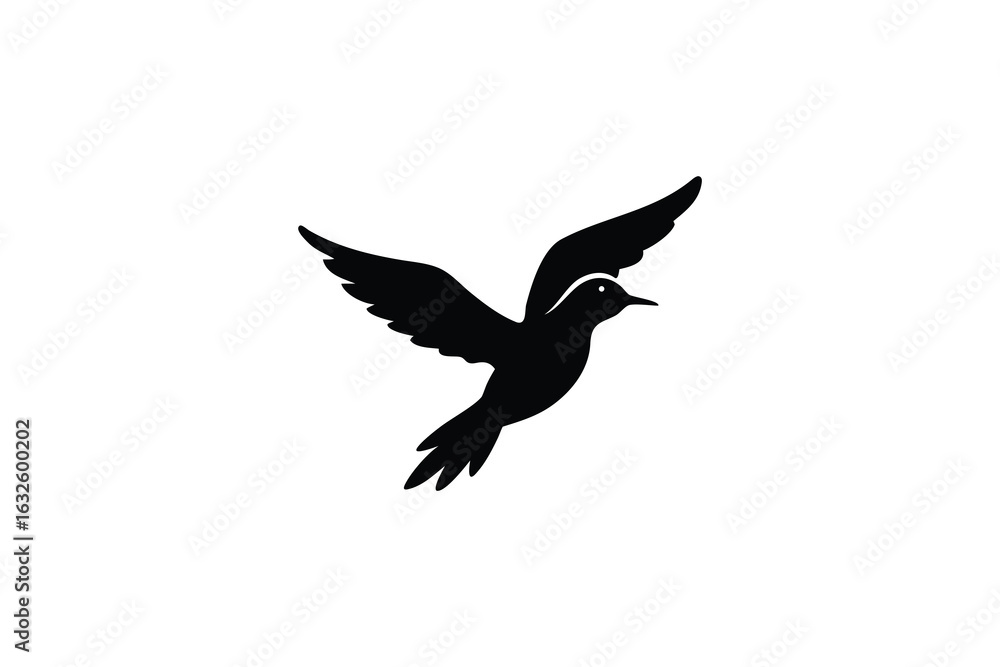 Obraz premium A striking black silhouette of a bird in mid flight with wings spread wide against a clean white background symbolizing freedom and nature s grace silhouette