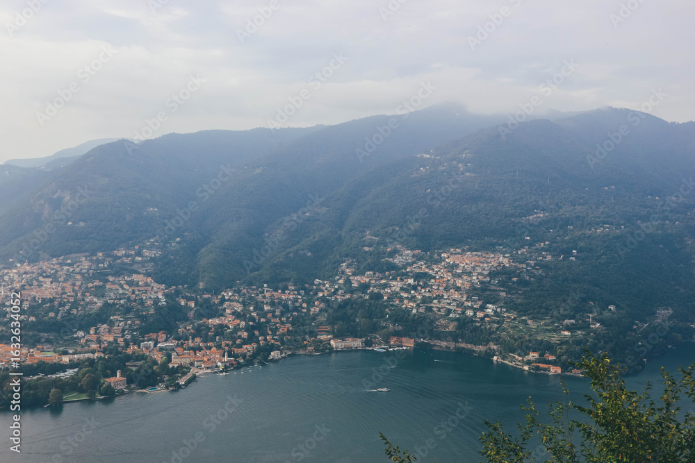Obraz premium view of the city of como from top amove with como lake tail bay italian alps in autumn