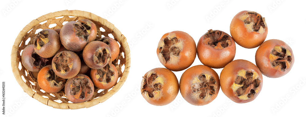 Obraz premium Brown fresh medlars in a wicker basket isolated on white background. Mespilus germanica . Top view. Flat lay