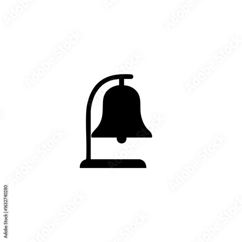 Black and white bell, a clear and resonant signal, placed on simple stand. Bell is commonly used to announce an event, signal start of school or sports, or alert staff in hotel.
