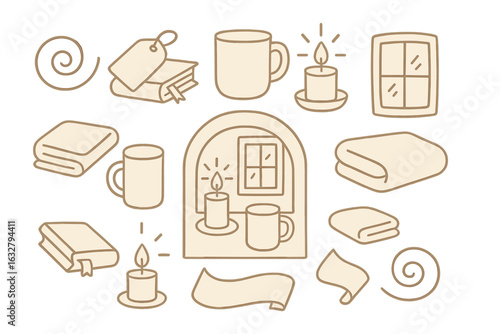 Cozy home decor elements featuring candles, books, and blankets creating a warm atmosphere