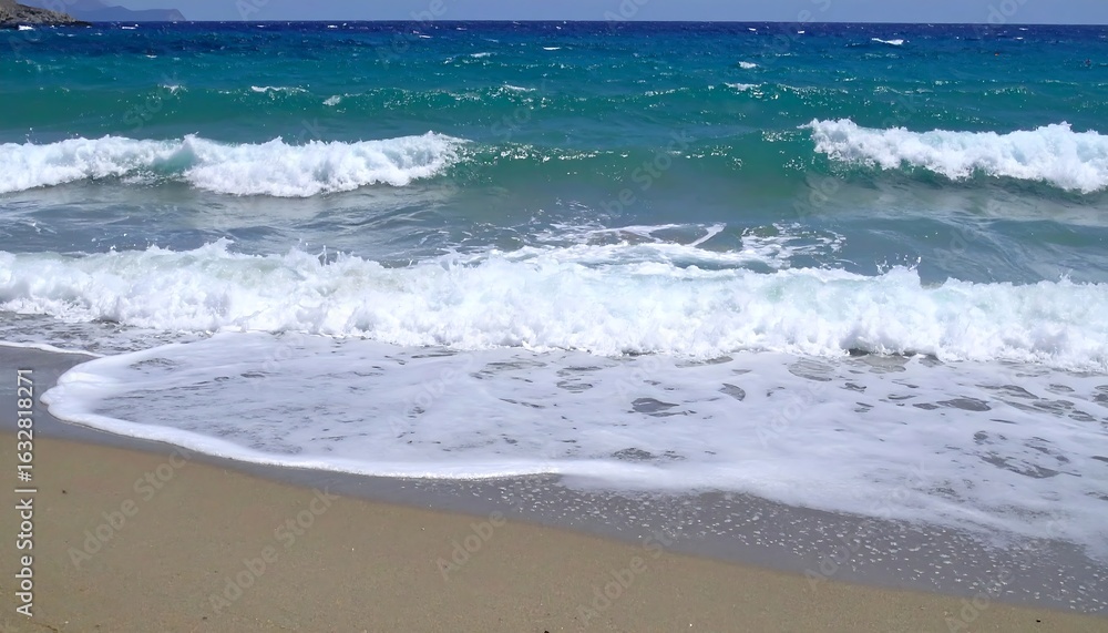 Fototapeta premium Turquoise waves on sandy beach