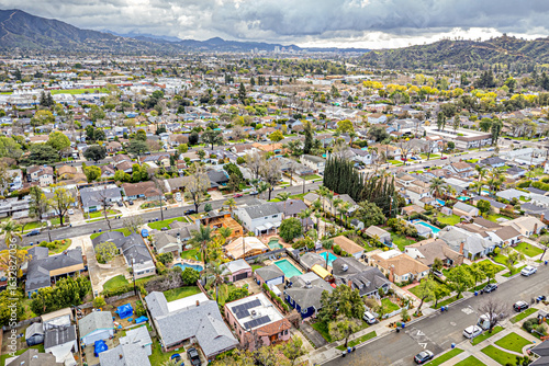 Burbank, CA, LA County, March 13, 2025: Aerial View of Village of Burbank around Burbank Downtown, Olive Ave, Alameda Ave, Oak St, with Mountain, Houses, Homes, Roads, Streets