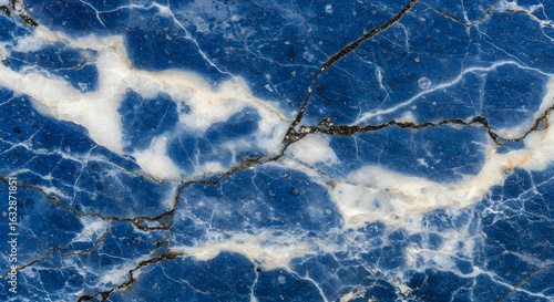 Striking blue marble texture with white veins and dark fractures creating unique abstract design