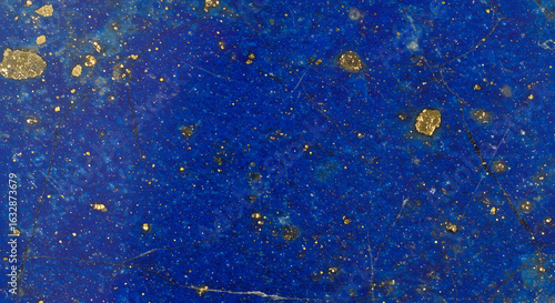 Intricate details reveal a captivating deep blue stone surface with shimmering gold inclusions.