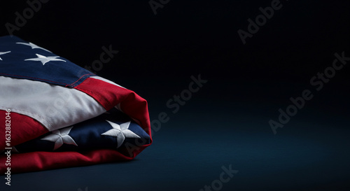 Wallpaper Mural A neatly folded American flag resting on a dark, somber background. Ideal for themes of patriotism, remembrance, freedom, and national holidays like Veterans Day or Memorial Day Torontodigital.ca