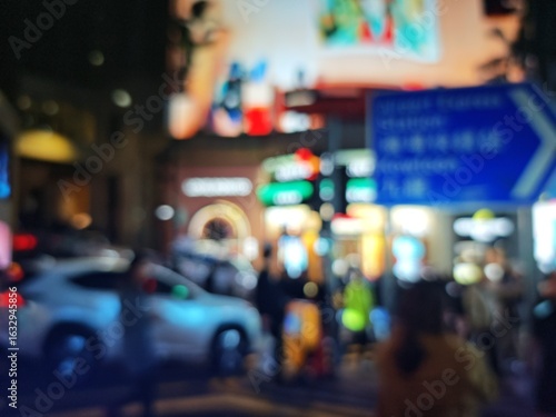 Wallpaper Mural Abstract bokeh image of Hong Kong city street at night with blurred lights and signs. Torontodigital.ca