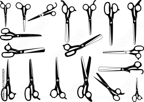 Collection of vintage style barber and sewing scissors displayed in a scattered artistic arrangement on a white background