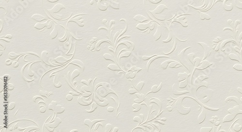 Classic white background with an elegant embossed floral damask pattern. A seamless vintage texture with ornate swirls and leaves for design.