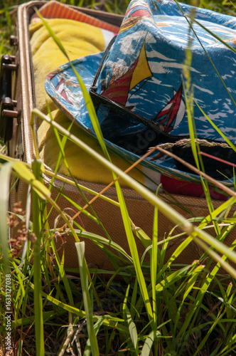 summer hat in a vintage suitcase