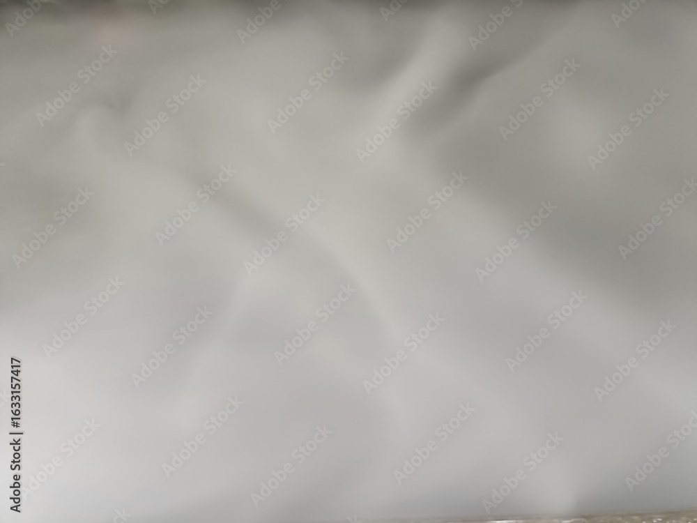Obraz premium Soft smooth light fabric material surface texture plain neutral background close up detail cloth textile white gray subtle gentle delicate airy airy fabric fabric surface fabric texture fabric