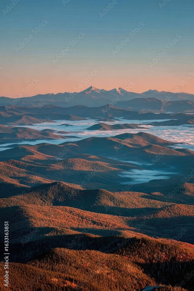 Fototapeta premium Mountain vista at dawn, hazy layers of hills and valleys