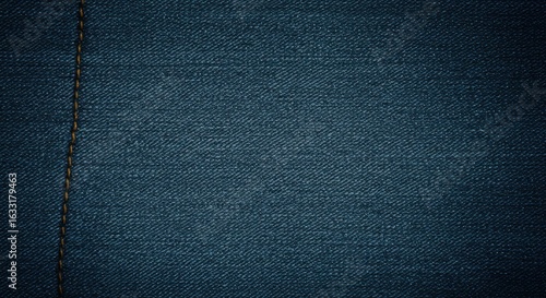 Deep Blue Denim Texture with Subtle Yellow Stitch Detail: Perfect for Fashion or Design Projects