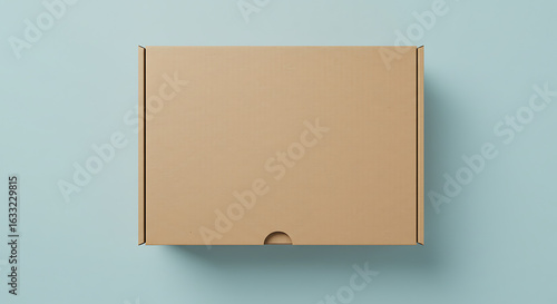 Blank brown cardboard delivery box mockup on a pastel blue background. Flat lay top down view of a carton for e-commerce packaging design.