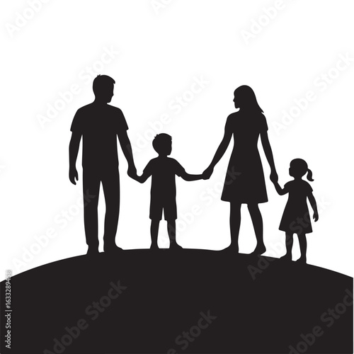 Happy family of four holding hands on a hilltop silhouette