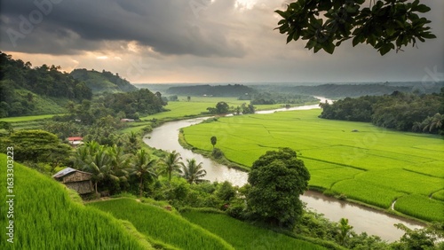 Lush green rice terraces and winding river under a dramatic sky