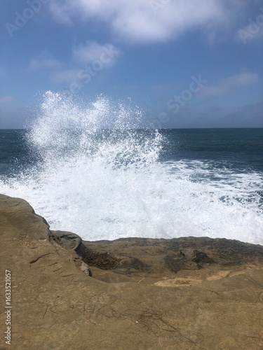 Waves hits cliff.