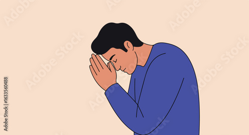 Man with hands clasped in prayer, head bowed, wearing a blue shirt