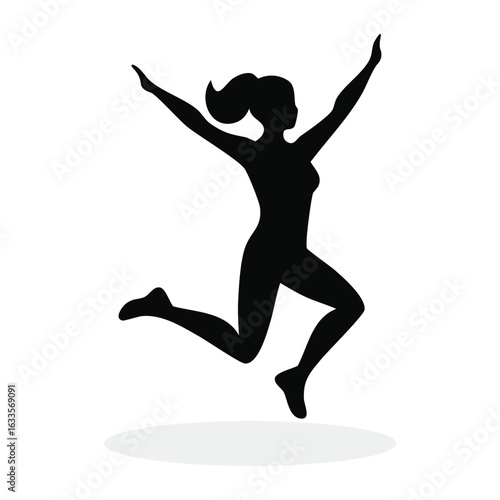 Silhouette of a happy and energetic woman jumping with joy and arms raised in the air celebrating success