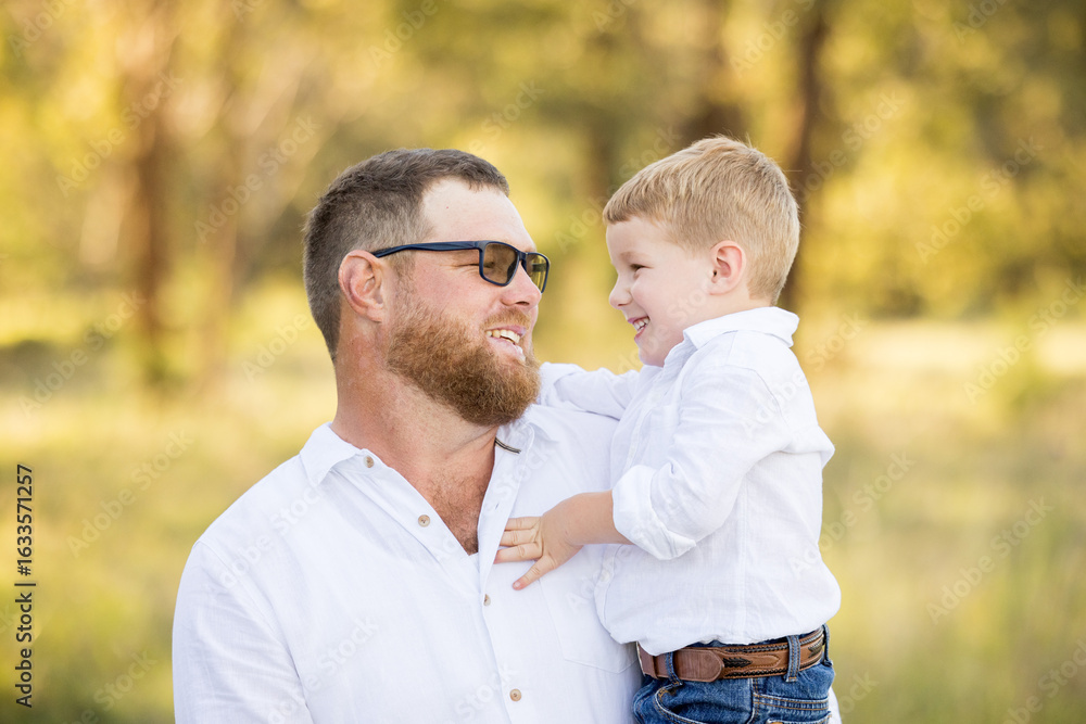 Obraz premium Father and son portrait in rural Australian bush setting